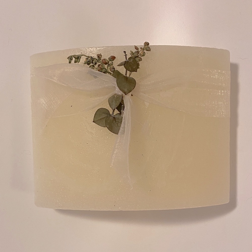 Chic Cream Candle with Sheer Ribbon and Greenery